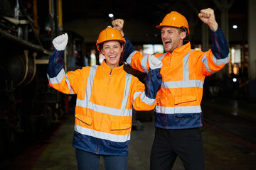 engineers or workers feeling happy after success work and project at construction train station