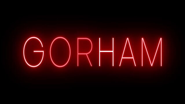 Flickering red retro style neon sign glowing against a black background for GORHAM