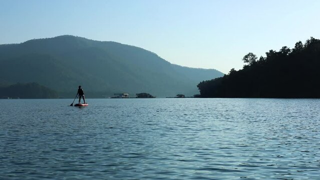 Paddleboarding on a Serene Lake