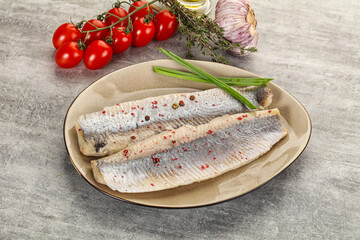 Marinated herring fillet with green onion - obrazy, fototapety, plakaty