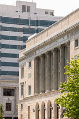 Obraz premium Kansas City, Missouri, USA - June 15, 2023: Afternoon light shines on historic buildings in downtown Kansas City.