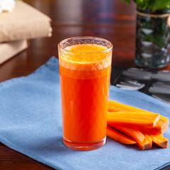Fresh carrot juice on the table, cafe, lunch