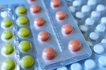 Various drugs: tablets, blister-packed tablets, pharmaceuticals, selective focus.