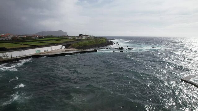 Aerial view of volcanic Zona Balnear do Negrito in Sao Mateus da Calheta, Azores