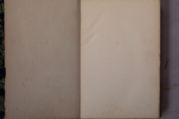 Top view on open antique book with blank yellow pages. High quality photo