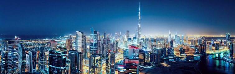 Fantastic nightime skyline of a big modern city. Downtown Dubai, United Arab Emirates. Colourful cityscape with skyscrapers. - 723589401