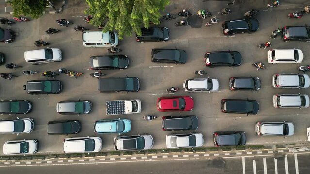 Top down view cars and motorcycle moving on traffic jam at rush hour
