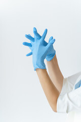 The doctor or cosmetologist wears sterile gloves to work with the patient. Medicine, cosmetology concept