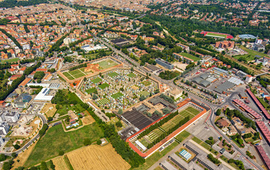 Parma, Italy. Cemetery Della Villetta. Panorama of the city on a summer day. Sunny weather with clouds. Aerial view