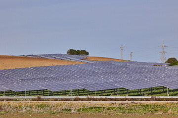 Electrical power plant with rows of solar panels for producing clean ecological electric energy. Renewable electricity with zero emission.
