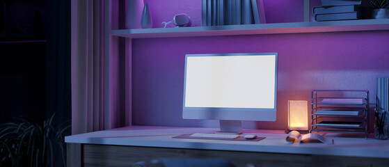 A modern home office workspace with a computer and a dim light from a table lamp on a table.