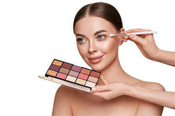 Makeup Artist applies Eye Shadow. Beautiful Woman Face. Perfect Makeup. Make-up detail. Beauty Girl...