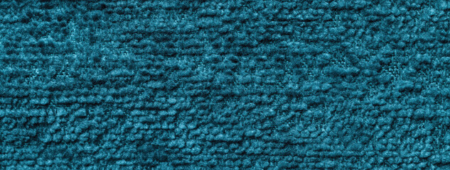 Texture of dark turquoise color background from textile material with pattern, macro.
