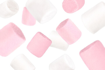 Levitation of white and pink marshmallows isolated on a transparent background.