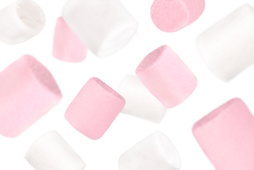 Levitation of white and pink marshmallows isolated on a transparent background.