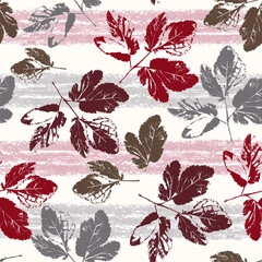 Seamless colorful pattern with leaves. Red, brown, gray leaves on a striped background. - 723606812