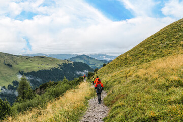 Fototapeta na wymiar Group of hiker hiking on Swiss Alps trail during summer at Switzerland