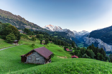 Fototapeta na wymiar Wengen mountain village with Jungfrau mountain and Lauterbrunnen valley in the evening