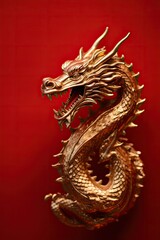 Fototapeta na wymiar Dragon Sculpture on Red Background