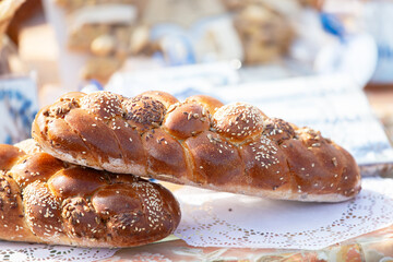 Beautiful braided loaf sprinkled with sesame seeds. Good grain harvest.