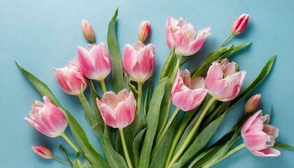 pink tulips in a vase.a beautiful composition of spring flowers. Arrange a cheerful bouquet of pink tulips on a pastel blue background, infusing the scene with a sense of joy and renewal.