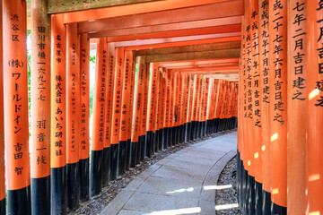 Fushimi Inari Shrine. Shinto shrine. Torii gates with Kanji engravings. Kyoto, Japan