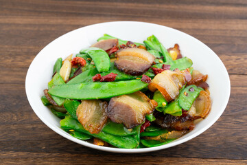 A plate of fried peas and bacon
