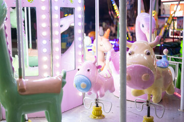 Carousel in amusement park at night