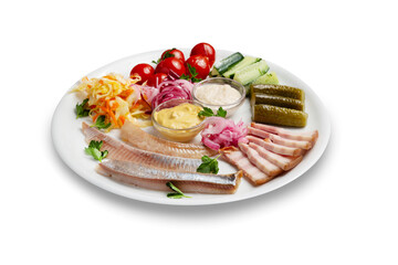 Assorted snacks, herring, pickled tomatoes and cucumbers, cabbage, onions in a plate, isolated