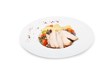 Caesar salad with chicken on a plate, isolated