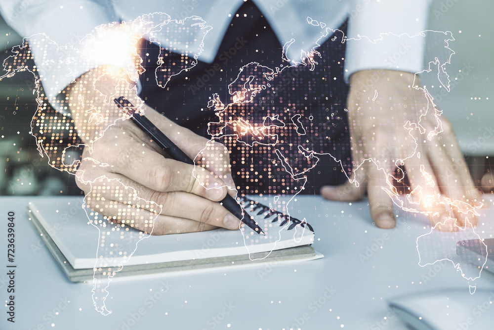Poster multi exposure of abstract graphic world map and hand writing in diary on background with laptop, bi