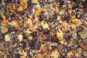 Crushed layers of biscuit dough with raisins and poppy. Cakes preparation process