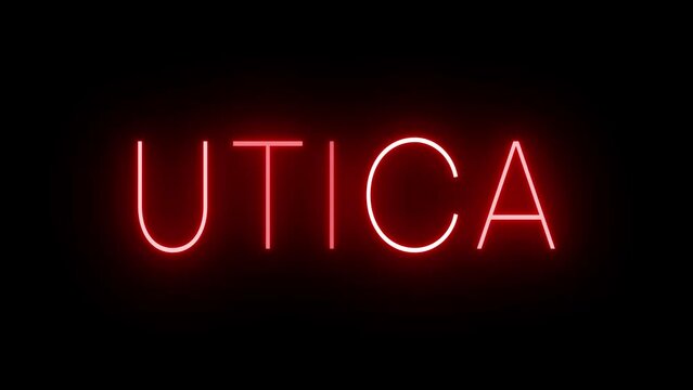 Flickering red retro style neon sign glowing against a black background for UTICA