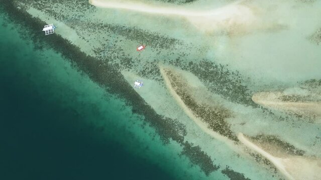 Aerial view of sandbar and coral reef in turquoise water. Negros, Philippines.