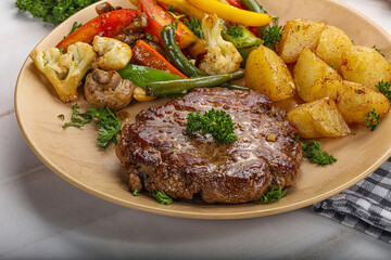 Roasted beef steak with potato