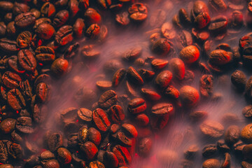  Roasted coffee beans with smoke and fire background. Close up,