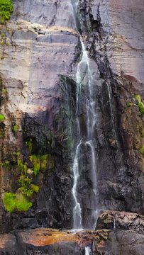 Aerial drone of Bambarakanda Falls in a mountain gorge. Waterfall in the tropical forest. Sri Lanka.