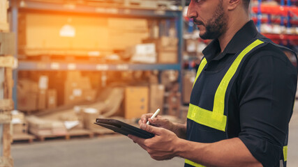 Close up Hispanic men hands using pen touch smart tablet Warehouse management logistics counting checking products on inventory shelf. Man hands worker check stock control in distribution storage