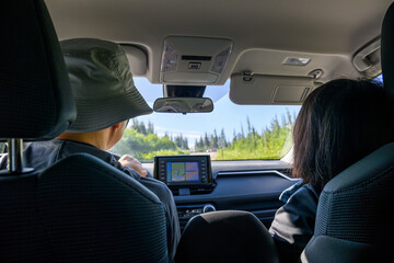 Couple driving towards the trailhead of Skyline loop trail. Mt Rainier National Park. Washington State. USA.