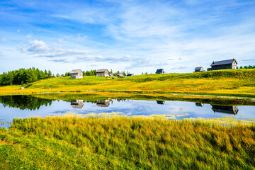 Tauplitzsee on the high plateau of the Tauplitzalm. View of the lake at the Totes Gebirge in Styria. Idyllic landscape by the lake on the Tauplitz in Austria.