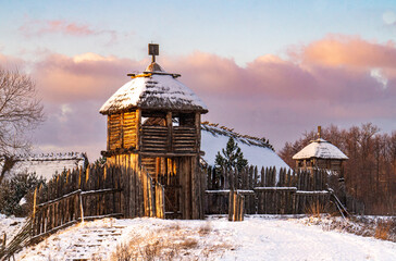 Wooden gate and fort. Winter countryside