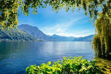 Foto auf Leinwand View of Traunsee and the surrounding landscape. Idyllic nature by the lake in Styria in Austria. Mountain lake at the Dead Mountains in the Salzkammergut.  © Elly Miller