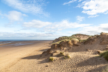 A view of the sandy beach at Formby, on a sunny summer's morning