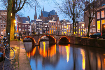 Amsterdam canal Leidsegracht with typical dutch houses and bridge at night, Holland, Netherlands - obrazy, fototapety, plakaty