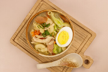 Chicken Sopas is Filipino Style Chicken Macaroni Soup with Flaked Chicken, Vegetables and Sausages.