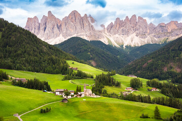 Dolomite mountains in summer with a green valley