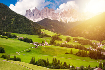 Dolomite mountains in summer with a green valley