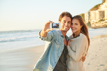 Couple, selfie and happy for hug by ocean for memory on vacation with care, love and bonding in...