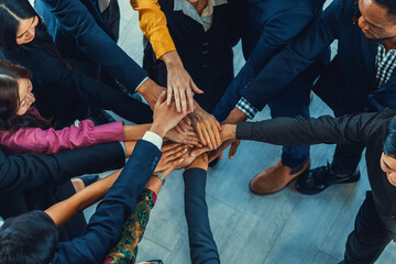 A group of diversity people putting their hands together. Showing unity teamwork and friendship....