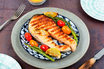 Plate of grilled salmon steak.